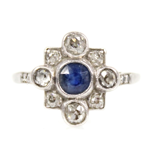 114 - An early 20th century sapphire and diamond transitional ring, the central round mixed cut sapphire m... 