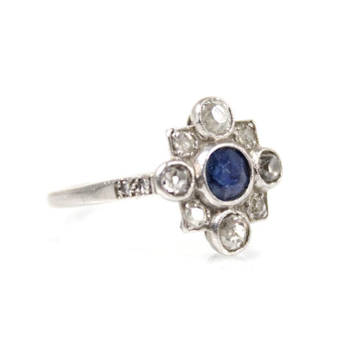 114 - An early 20th century sapphire and diamond transitional ring, the central round mixed cut sapphire m... 