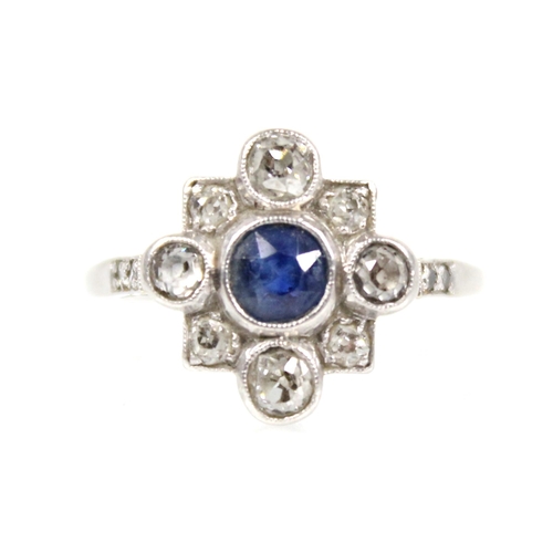 114 - An early 20th century sapphire and diamond transitional ring, the central round mixed cut sapphire m... 