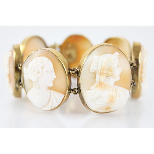 117 - A Victorian carved shell cameo bracelet, comprising seven oval carved shell cameo panels, each carve... 