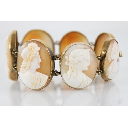 117 - A Victorian carved shell cameo bracelet, comprising seven oval carved shell cameo panels, each carve... 