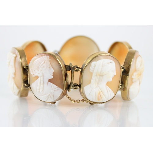 117 - A Victorian carved shell cameo bracelet, comprising seven oval carved shell cameo panels, each carve... 