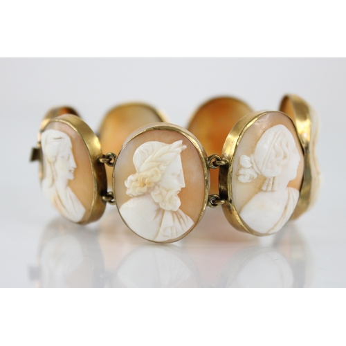 117 - A Victorian carved shell cameo bracelet, comprising seven oval carved shell cameo panels, each carve... 