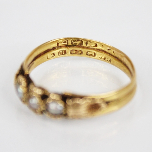 118 - A 19th century pearl set ring, comprising three off-round pearls set to gold coloured beaded borders... 