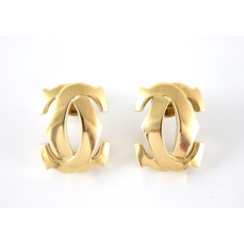 148 - A pair of Cartier 'C de Cartier' 18ct gold earrings, modelled as interlocking C motifs, signed Carti... 