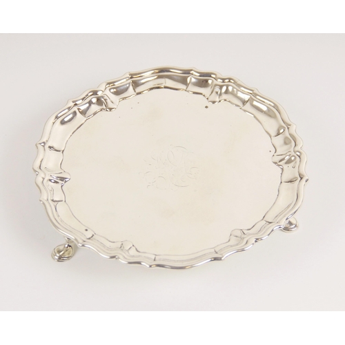 15 - A George II silver waiter, John Tuite, London 1735, of circular form with pie crust border on three ... 
