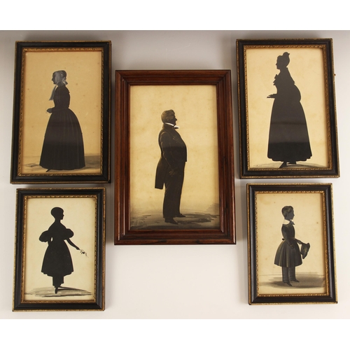 159 - Three full length cut paper silhouettes, 19th century, depicting a lady, a gentleman and a young boy... 