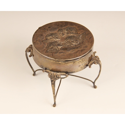 17 - An Edwardian silver jewellery casket, Synyer & Beddoes, Birmingham 1905, of circular form raised on ... 