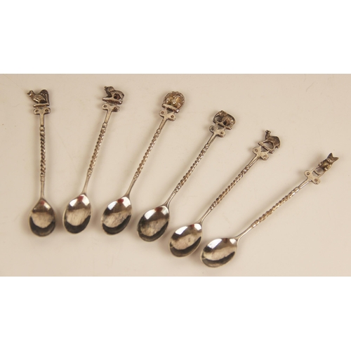 29 - A set of six silver coloured coffee spoons, each with terminals modelled as elephants, 9.7mm long, t... 