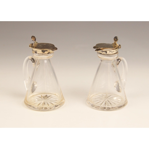 36 - A pair of George V cut glass silver mounted whiskey noggin, Hukin & Heath, Birmingham 1915, each tap... 