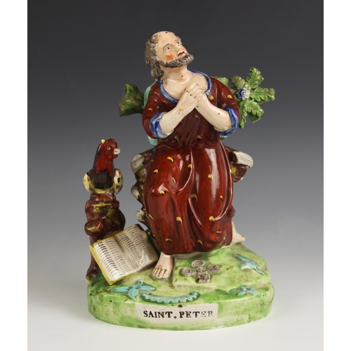 469 - A Staffordshire figure titled 'Saint Peter', early 19th century, modelled kneeling with crossed keys... 