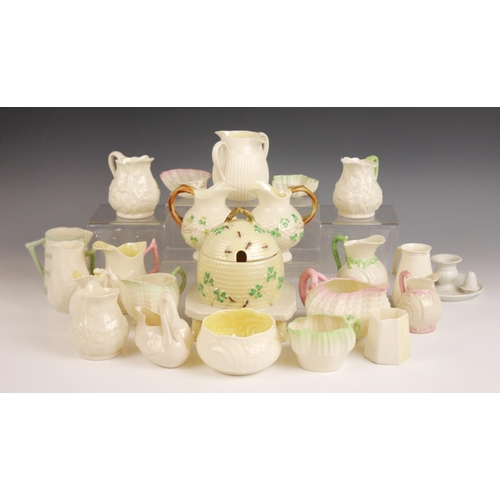 477 - A selection of Belleek porcelain tableware, to include a double spouted milk jug, 19th century, 8.5c... 