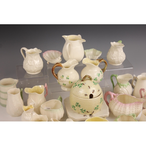 477 - A selection of Belleek porcelain tableware, to include a double spouted milk jug, 19th century, 8.5c... 