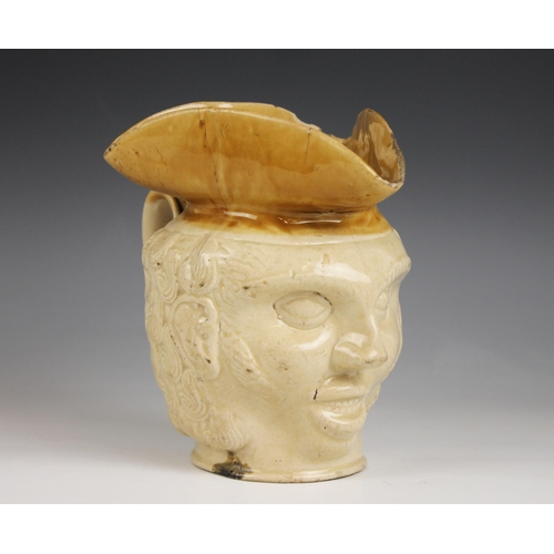 483 - A late 18th or early 19th Century stoneware character jug, the brown-glazed tricorn hat forming thre... 