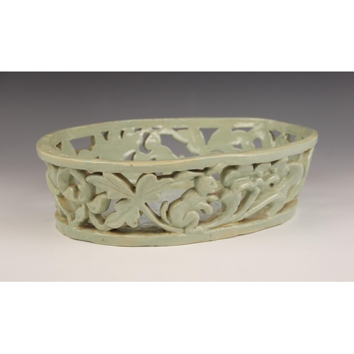 489 - An Art Deco, Art Pottery shallow pierced basket of oval form, the gallery depicting leaping deer and... 