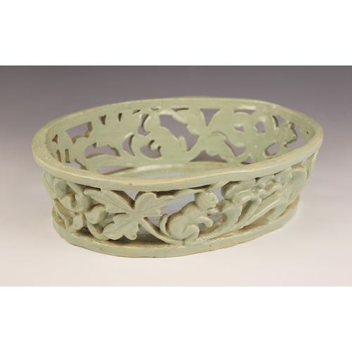 489 - An Art Deco, Art Pottery shallow pierced basket of oval form, the gallery depicting leaping deer and... 