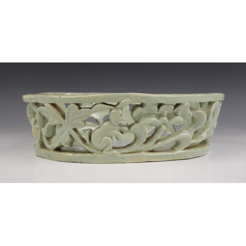 489 - An Art Deco, Art Pottery shallow pierced basket of oval form, the gallery depicting leaping deer and... 