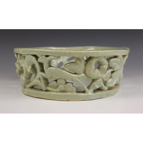 489 - An Art Deco, Art Pottery shallow pierced basket of oval form, the gallery depicting leaping deer and... 