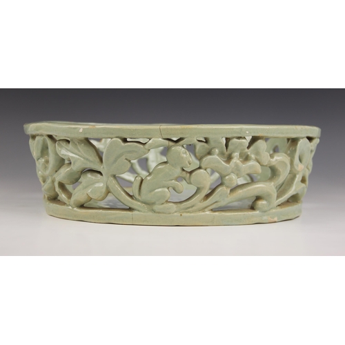 489 - An Art Deco, Art Pottery shallow pierced basket of oval form, the gallery depicting leaping deer and... 