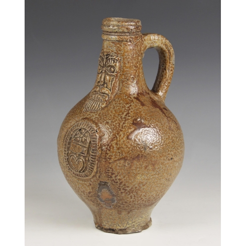 490 - A 17th century Armorial bellarmine jug, the salt glazed stoneware jug of typical swollen form and ap... 