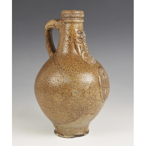 490 - A 17th century Armorial bellarmine jug, the salt glazed stoneware jug of typical swollen form and ap... 