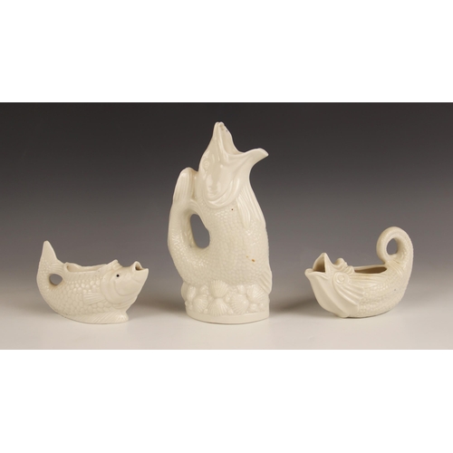 522 - A Victorian milk glass cream jug modelled as a fish, late 19th century, 14cm wide, with a further mi... 