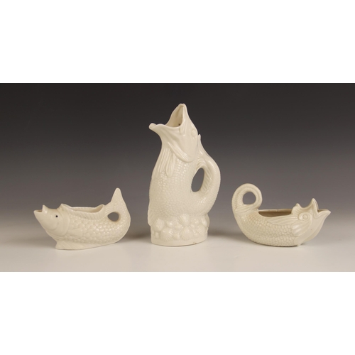 522 - A Victorian milk glass cream jug modelled as a fish, late 19th century, 14cm wide, with a further mi... 