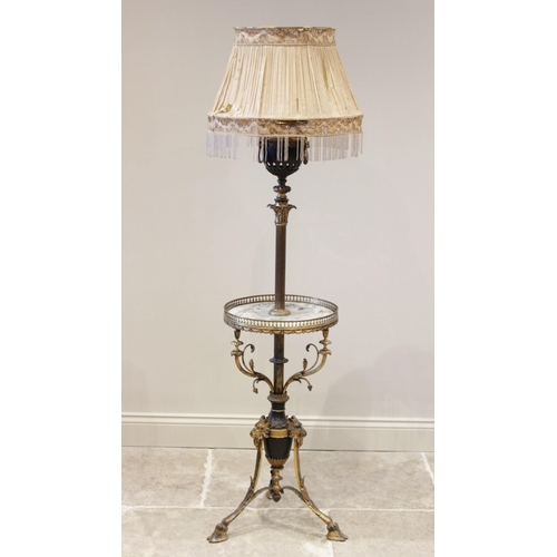 527 - A Rococo style brass standard lamp/wine table, late 19th, early 20th century, the converted oil lamp... 