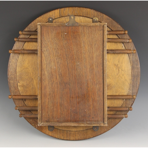 572 - A circular mahogany perpetual wall calendar, mid 20th century, the front with three glazed apertures... 