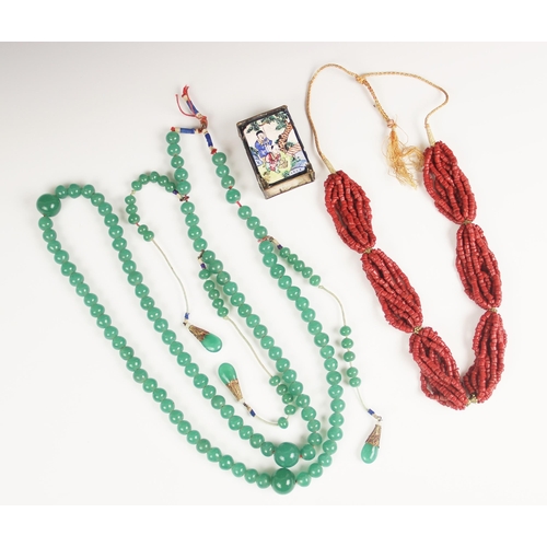 61 - A Chinese jade coloured glass bead necklace, designed as a single row a off-round jade coloured glas... 