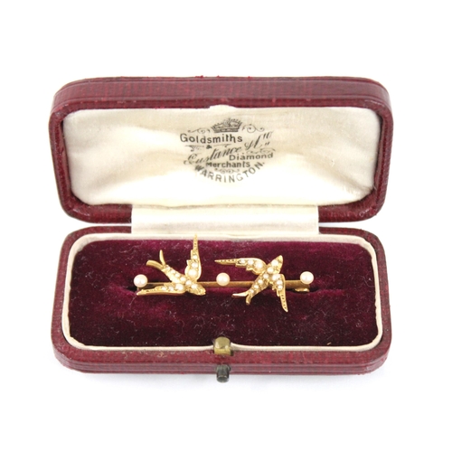 62 - A Victorian pearl set swallow brooch, designed as two swallows in flight with pearls set to bodies, ... 