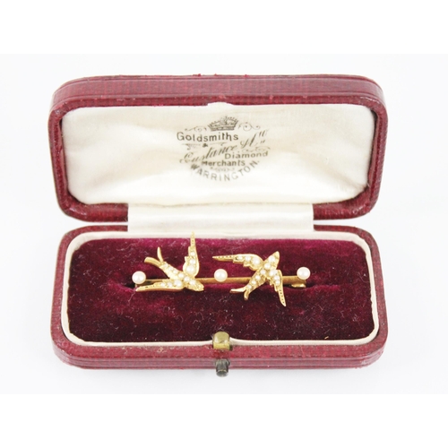 62 - A Victorian pearl set swallow brooch, designed as two swallows in flight with pearls set to bodies, ... 