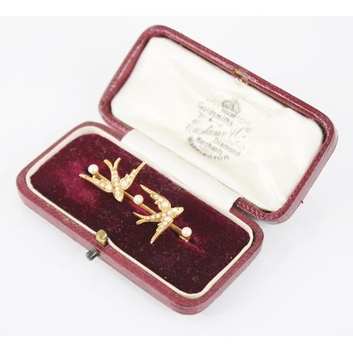 62 - A Victorian pearl set swallow brooch, designed as two swallows in flight with pearls set to bodies, ... 