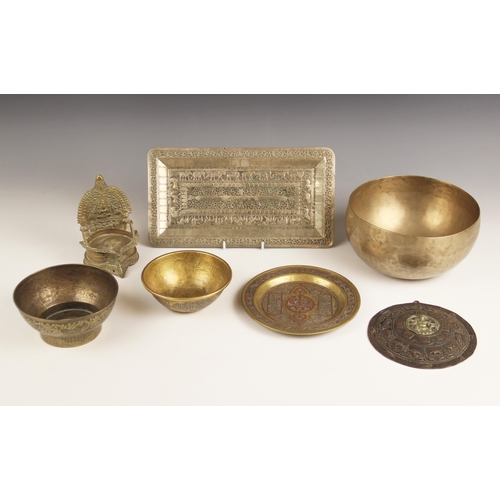 651 - A selection of Indian and Middle Eastern and South East Asian metal wares, to include an Islamic Dam... 