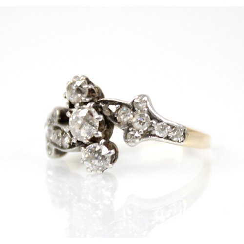 66 - A Victorian diamond foliate ring, comprising a central old cut diamond measuring approximately 3.75m... 