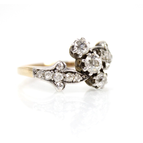 66 - A Victorian diamond foliate ring, comprising a central old cut diamond measuring approximately 3.75m... 