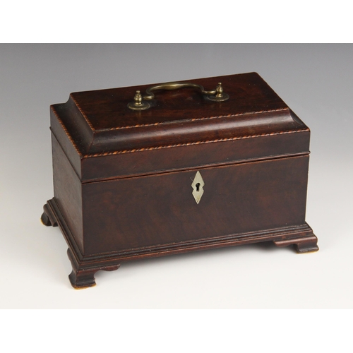 667 - A George II mahogany tea caddy, the hinged pagoda cover with brass swing handle, inlaid with chevron... 