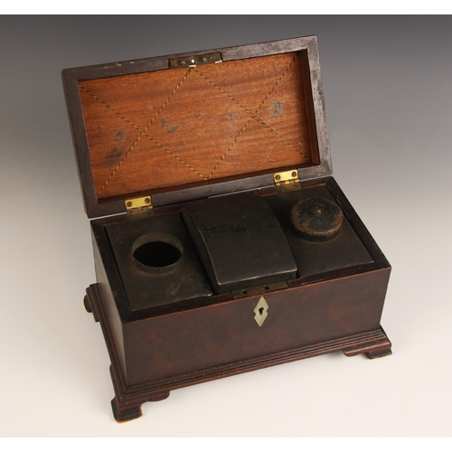 667 - A George II mahogany tea caddy, the hinged pagoda cover with brass swing handle, inlaid with chevron... 