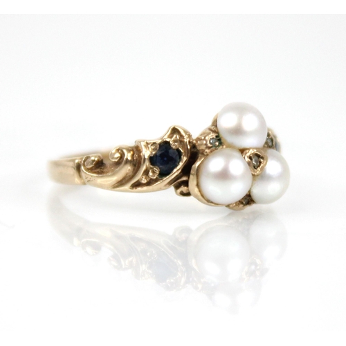 67 - A Victorian style pearl, diamond and sapphire 9ct gold ring, the floral head comprising three mabe p... 