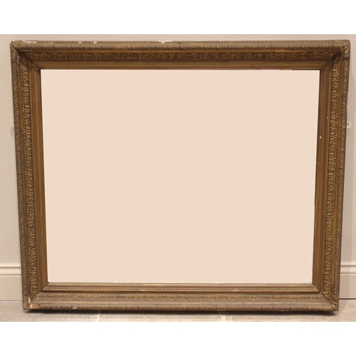 693 - A 19th century giltwood and gesso wall mirror, the later rectangular mirrored plate within a bead an... 