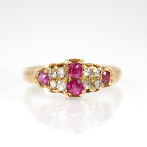 70 - A Victorian ruby and diamond 18ct gold ring, the lozenge shaped head set with two mixed cut rubies, ... 