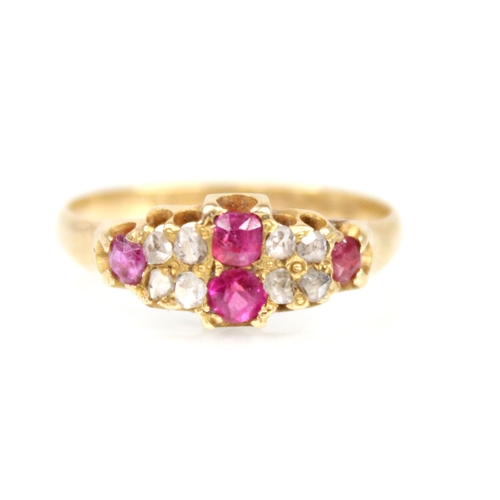 70 - A Victorian ruby and diamond 18ct gold ring, the lozenge shaped head set with two mixed cut rubies, ... 