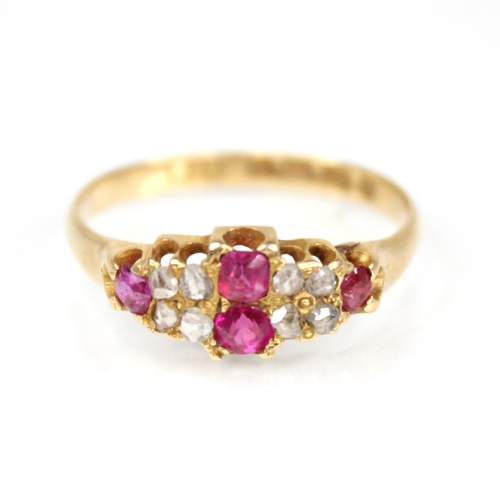 70 - A Victorian ruby and diamond 18ct gold ring, the lozenge shaped head set with two mixed cut rubies, ... 