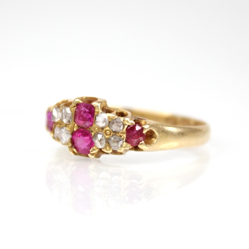 70 - A Victorian ruby and diamond 18ct gold ring, the lozenge shaped head set with two mixed cut rubies, ... 