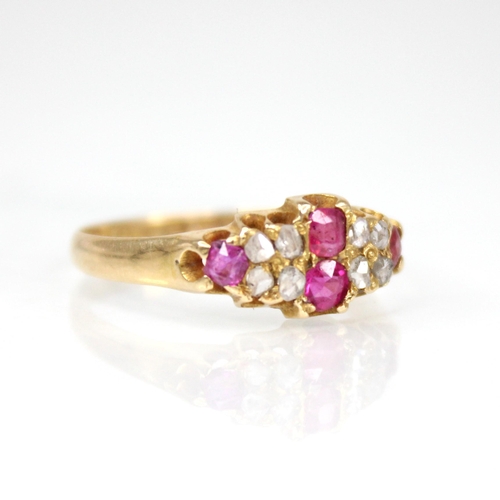 70 - A Victorian ruby and diamond 18ct gold ring, the lozenge shaped head set with two mixed cut rubies, ... 