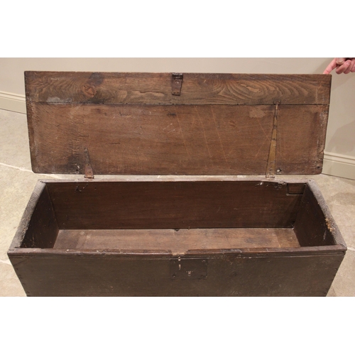 707 - A 17th century and later oak six plank coffer, the hinged plank top with a channelled edge, raised u... 