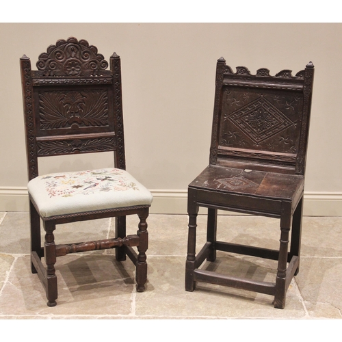 710 - A 17th century carved oak back stool, the carved scroll top rail above a leaf carved back panel and ... 