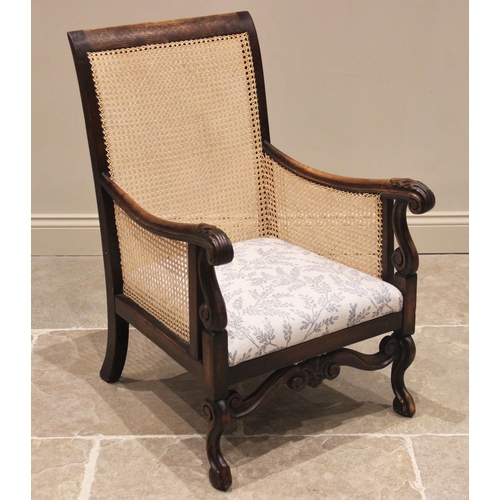 713 - A Carolean style walnut and rattan armchair, late 19th century, the rectangular cane work back rest ... 