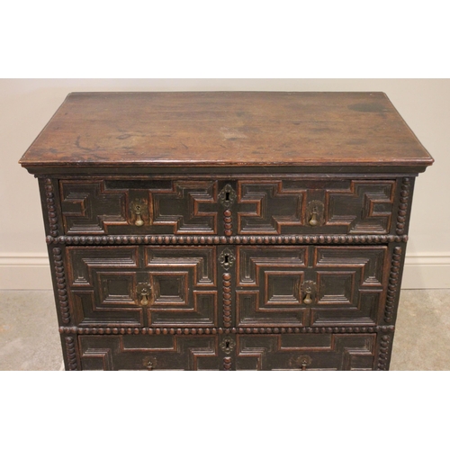 724 - A Jacobean oak chest of drawers, late 17th century, the twin plank top above an arrangement of three... 