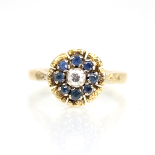 73 - A sapphire and diamond floral cluster ring, the central round brilliant cut diamond weighing approxi... 